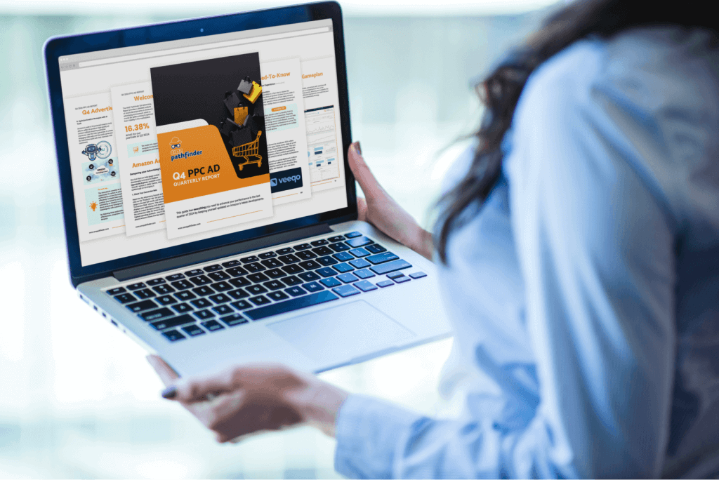 A person in a blue shirt holds a laptop showing the Q4 PPC Ad Quarterly Report, with several pages visible, including charts, tips, and strategies for Amazon sellers.